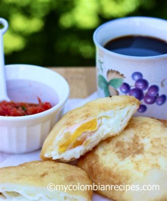  Arepa de Huevo: A Colombian Delight That Melts in Your Mouth and Bursts with Savory Flavor!